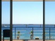 a photograph of a balcony facing the Mediterranean, a place eva works from sometimes