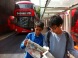 Photo of Eva's 2 sons in London, browsing the paper
